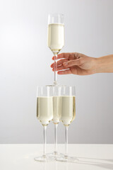 Glasses of champagne on a light background