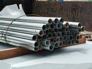 Iron pipes in stack ready for fabrication.