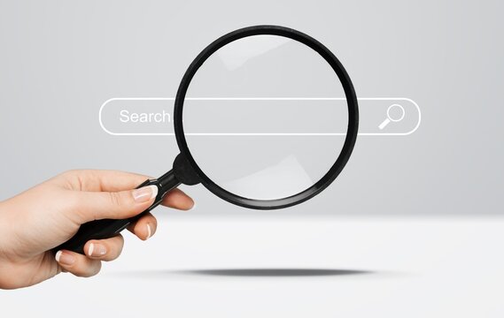 Magnifying glass and search bar on background