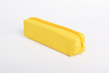 Bright yellow school pencil case isolated on white background. School stationery. Back to school. Copy space