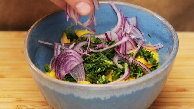 Cooking fish Peruvian ceviche close-up. Fresh cooked ceviche made of raw white fish. Traditional Peruvian cuisine. Cooking seafood dish.