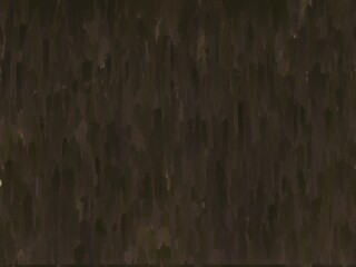 Dark brown abstract textured background with a vertical brush stroke effect.