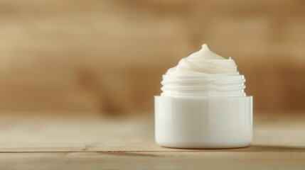 Palm oil shea butter. A simple white container holds creamy lotion, set against a warm wooden backdrop, suggesting natural skincare.