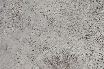 Abstract, textured background. A closeup of cement and asphalt for the construction. Material and stone for sidewalk or street construction.