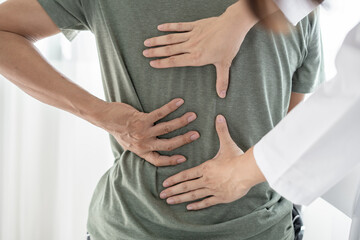 Male patients consulted physiotherapists with Low back pain for examination and treatment. Rehabilitation physiotherapy concept