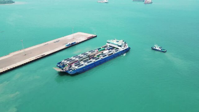 Car carrier ship. Car ferry leaving docks fully loaded.