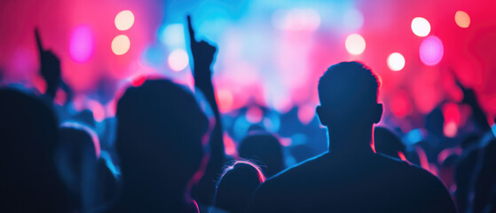 Award ceremony attendees united on stage, celebrating achievements amidst a vibrant, indistinct backdrop of the event atmosphere