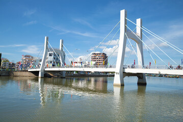 Modern cable-stayed bridge over the river Tu Sa on a sunny day. Phan Thiet, Vietnam