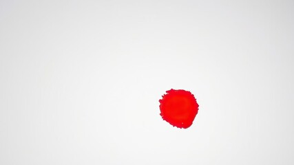 A small blot of bright red paint forms a comma shape on a plain white background, with bold brushstrokes visible throughout the image, simplecomposition, abstractart, dotpattern