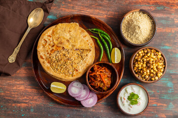 Sattu paratha is a popular stuffed flatbread from Uttar Pradesh and Bihar, served with tangy pickle...