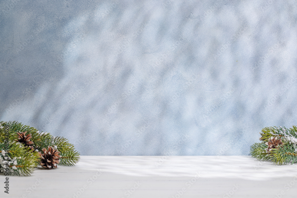 Aufkleber christmas template featuring snowy fir tree branches on a table with shadows and sun glares softly f