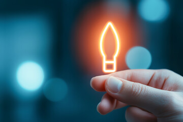 A hand holding a glowing light bulb symbol representing innovative ideas.
