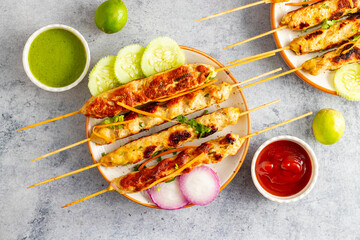 Juicy chicken seekh kababs, grilled to perfection, served with refreshing mint chutney and tangy...