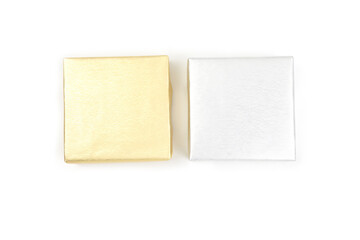 Top view, gold and silver color gift box isolated on a white background. Gift box concept for happy birthday, thank you, congratulation, mother's day, anniversary, Valentine's day, and holiday..