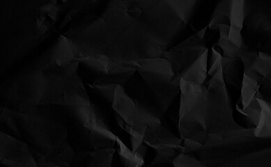 Wrinkled paper black background abstract wall crease grey vintage wallpaper rough floor pattern material surface page elegant retro space crumpled package cardboard backdrop recycling environment.