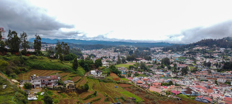 A Dramatic high angle view of the Ooty cityscape known for its Bewitching landscapes and scenery, is a popular travel destination in Tamil Nadu, India.