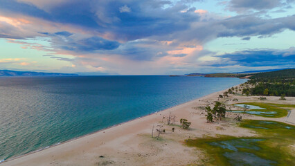 flying over the shore of Lake Baikal on Olkhon island at dawn
