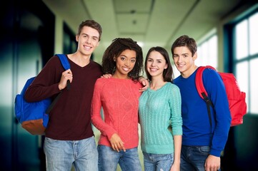 Happy college student friends talking and smiling