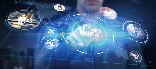 Business, Technology, Internet and network concept. Young businessman shows the word: Boost your business.