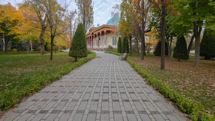 Pathway Through Park Leading to Ornate Building with Dome