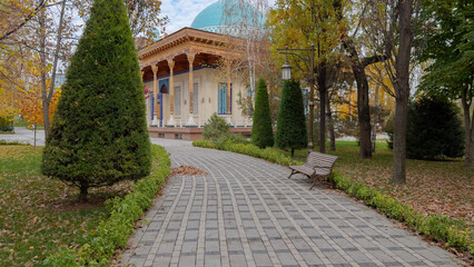 Pathway Through Park Leading to Ornate Building with Dome