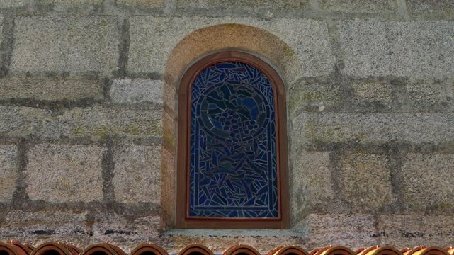 Stone window close-up of Santa Mar&iacute;a de Parada de Outeiro church in Vilar de Santos, Galicia