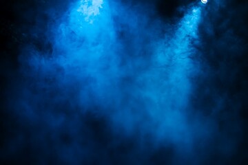 Fototapeta premium Blue Stage Lights Shining In Darkened Environment.