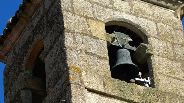 Closer view of bell tower at Santa Mar&iacute;a de Parada de Outeiro church, Vilar de Santos, Spain