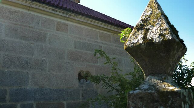 Side angle of Santa Mar&iacute;a de Parada de Outeiro church in Vilar de Santos, Galicia, Spain