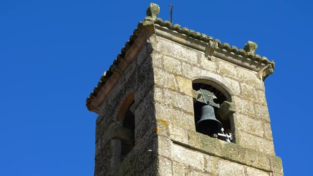 Stone bell tower of Santa Mar&iacute;a de Parada de Outeiro church in Vilar de Santos, Galicia, Spain