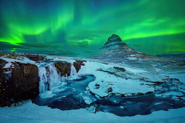 Aurora borealis or northern lights over Kirkjufell Mountain in Iceland