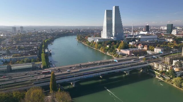 Basel with rhine river and roche towers on a clear autumn day in Switzerland, aerial view