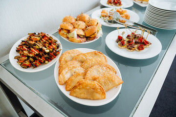 On the dining table, you can find a delightful array of diverse types of food, showcasing various cuisines and unique ingredients that make each dish distinct and incredibly flavorful