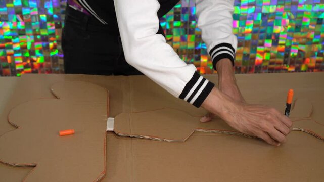 Tracing Shape on Cardboard for DIY Craft Project