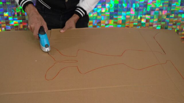 Cutting Outline from Cardboard with Electric Tool for party decor