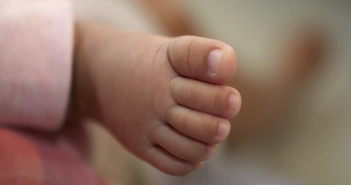 An up-close view of a baby&rsquo;s feet with perfectly arranged toes, showcasing the child's good health and natural development. Great for parenting and baby care topics.