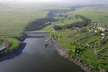 Aerial view of Aparan Reservoir, Jrambar village and Kasagh canyon on a spring day. Armenia.