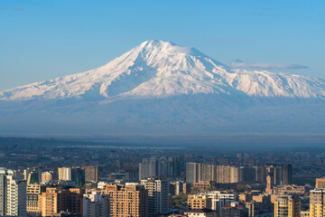 Telephoto view of Yerevan and Mount Ararat cowered with snow on sunny spring morning. Armenia.