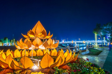 Beautiful light color Decorated Krathong Made in front of Naresuan Bridge for The Loy Krathong festival 2024 at night in Phitsanulok, the full moon of the 12th month Be famous festival of Thailand.