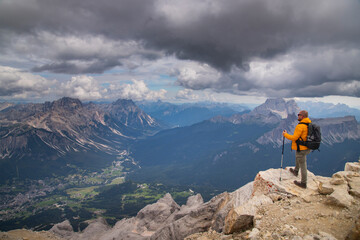 Hiker enjoys the view from Tofana di Mezzo in the italian Dolomites.