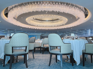 Formal and elegant ocean view dining room restaurant onboard luxury cruiseship or cruise ship liner...