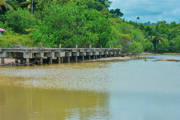 Abandoned pier bridge on the sea shore