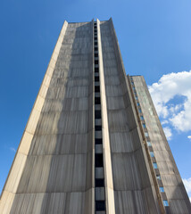 The building is tall and has a lot of windows