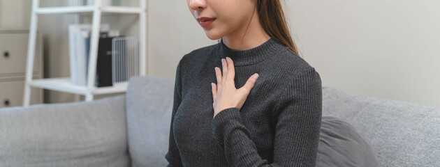Women feeling pain in her chest from reflux acid