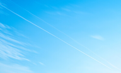 Motion blur background with sky scenery and airplane smoke.