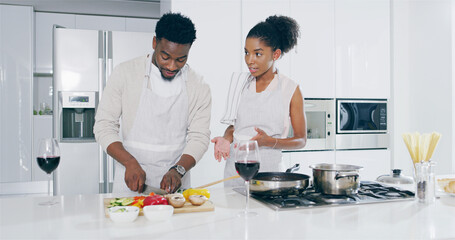 Couple, kitchen and cutting vegetables with wine glasses on conversation, bonding and love. Home, people and relationship with cooking for meal prep, romantic dinner and nutrition for valentines day