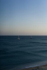 Fototapeta premium Sailing boat in the sea off the coast of Sagres