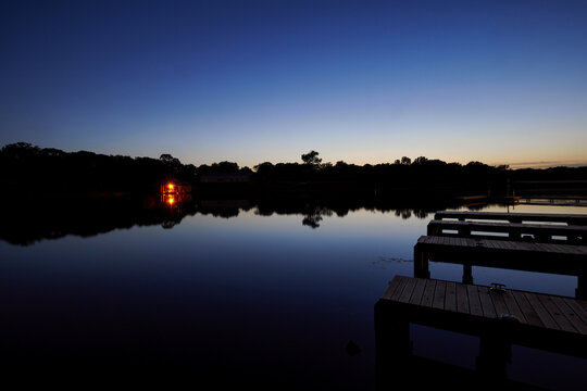 Lake Cabin on a calm lake at sundown