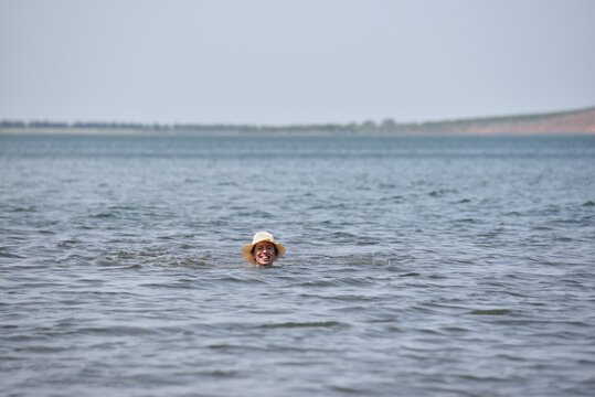 A person enjoying a swim in a calm lake