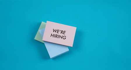 We’re Hiring words on colourful sticky notes. Business and financial concept quotes. Life and inspirational quotes.